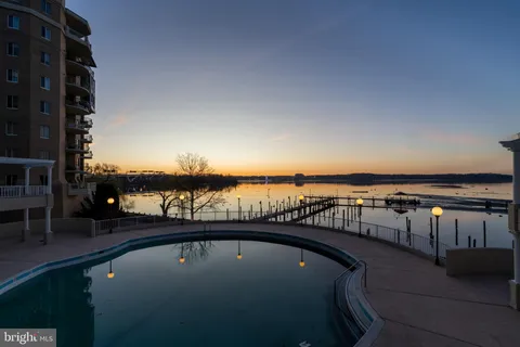 a view of swimming pool with furniture