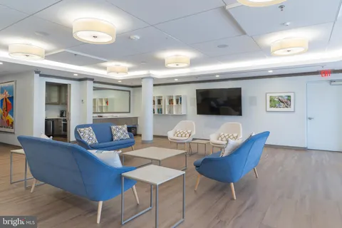 a front view of a residential apartment building with a yard