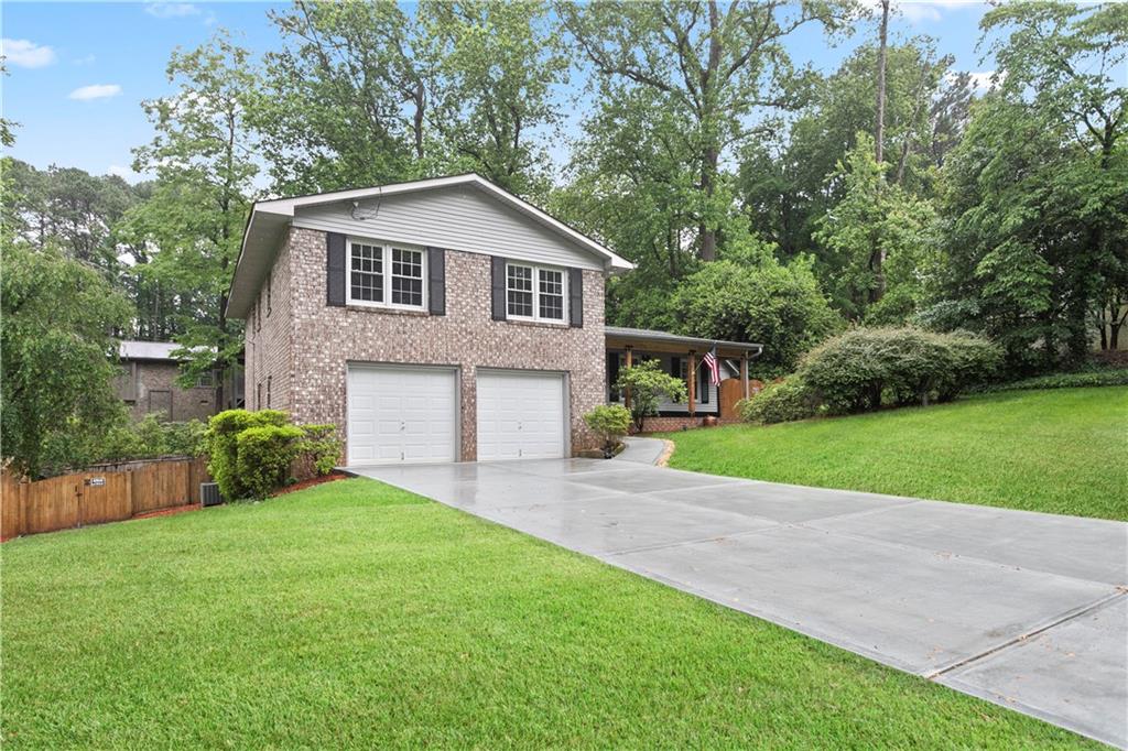 4081 Longview Drive Chamblee, GA 30341 - Photo 1 of 1 a front view of house with yard and green space