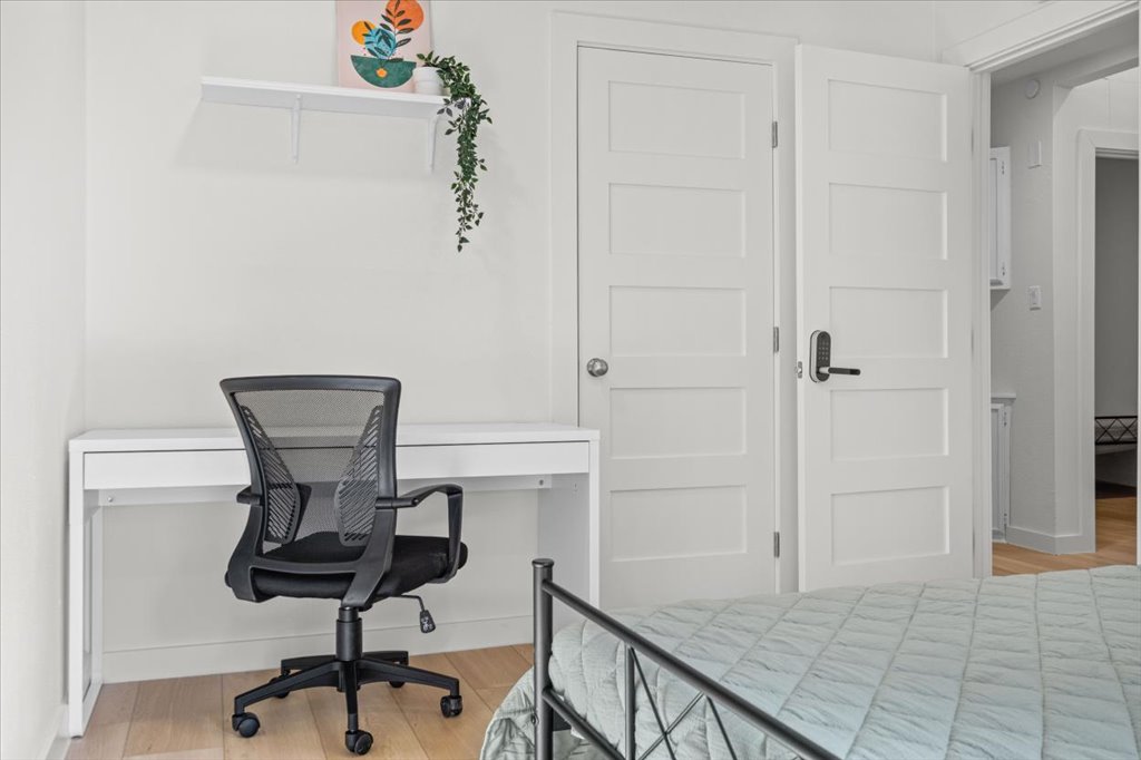1406 North Georgetown Street Round Rock, TX 78664 - Photo 10 of 34 Functional workspace with light wood flooring and crisp white walls for an airy feel.