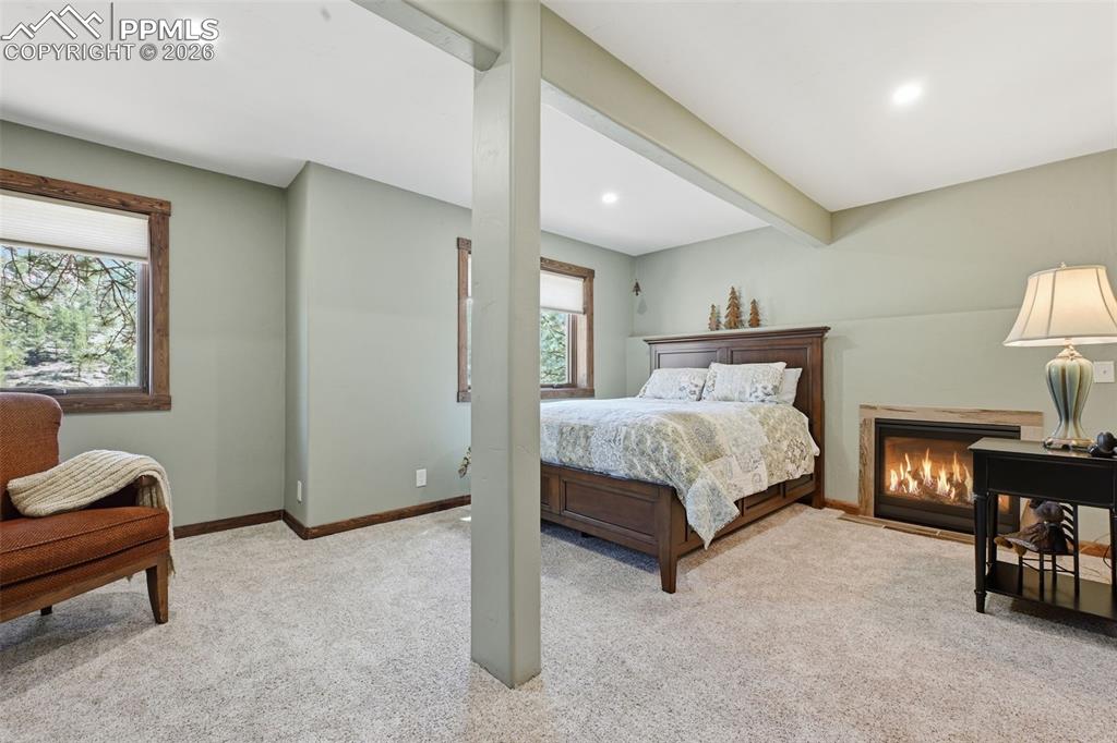 89 Ranch View Road Florissant, CO 80816 - Photo 36 of 50 Newly refinished garden level offers a reading nook and a propane fireplace.