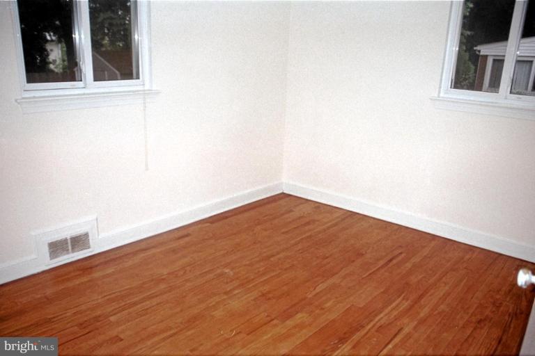 6003 Brunswick Street Springfield, VA 22150 - Photo 12 of 17 Fresh paint & gleaming hardwood floors.