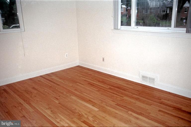 6003 Brunswick Street Springfield, VA 22150 - Photo 13 of 17 Fresh paint & gleaming hardwood floors.