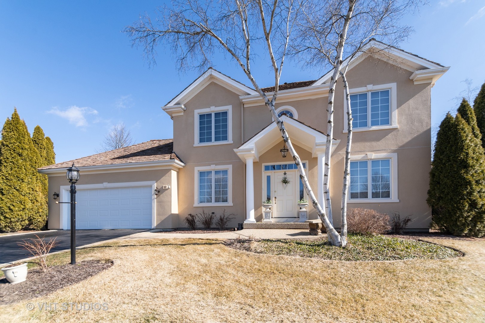 8 Torrin Rocks Cove Inverness, IL 60010 - Photo 2 of 30 a front view of a house with a yard