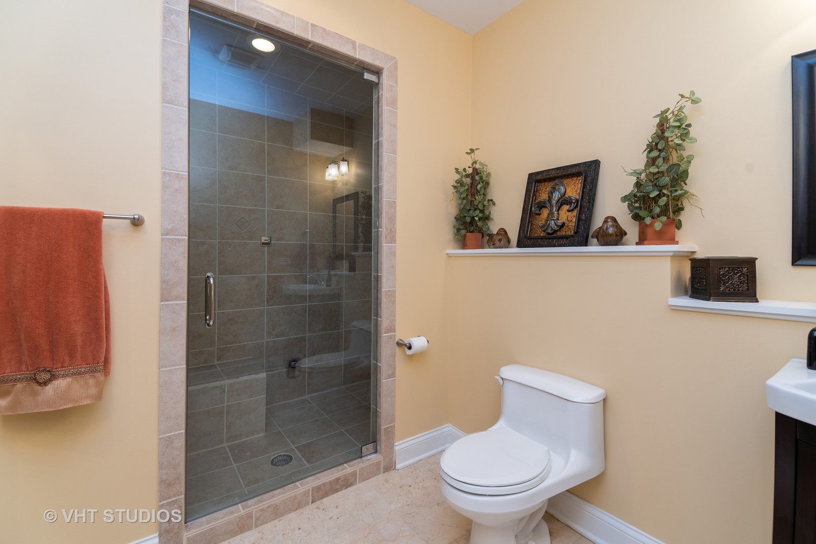 8 Torrin Rocks Cove Inverness, IL 60010 - Photo 23 of 30 a white toilet sitting next to a bathroom sink