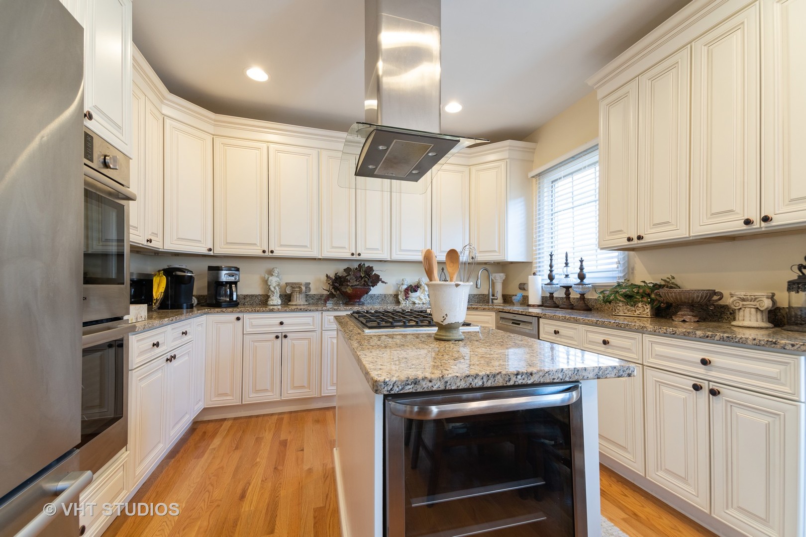 8 Torrin Rocks Cove Inverness, IL 60010 - Photo 7 of 30 a kitchen with stainless steel appliances granite countertop a stove sink and cabinets