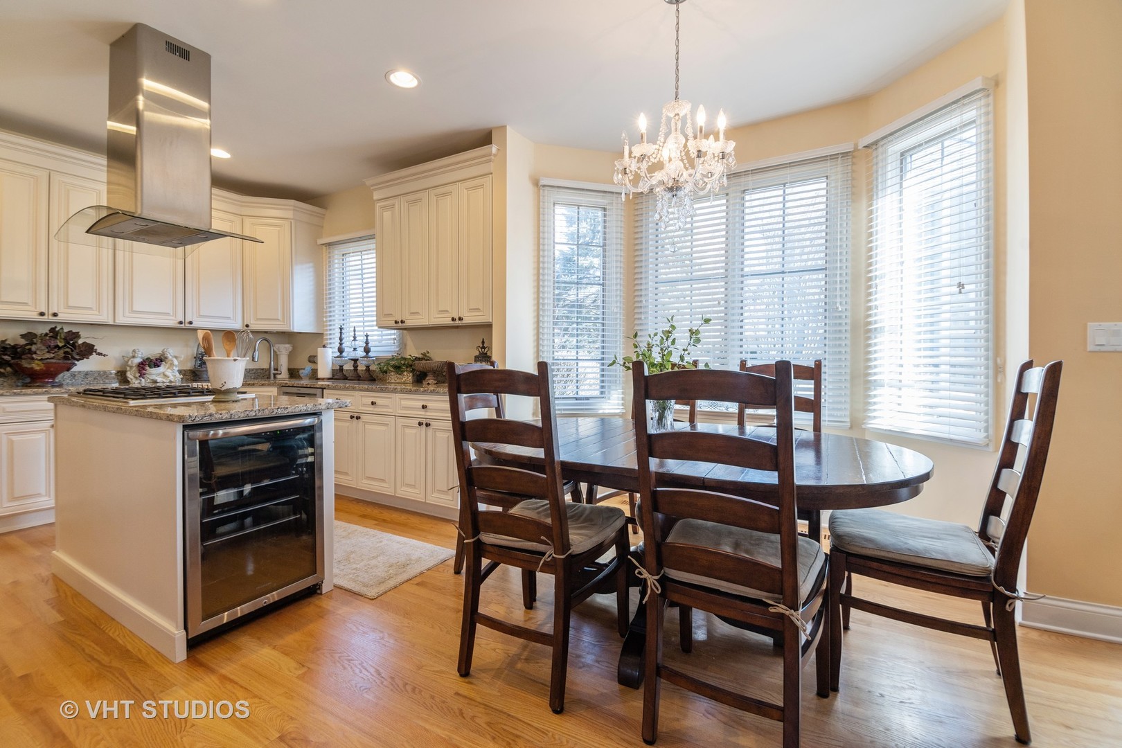 8 Torrin Rocks Cove Inverness, IL 60010 - Photo 8 of 30 a dining room with furniture a chandelier and wooden floor