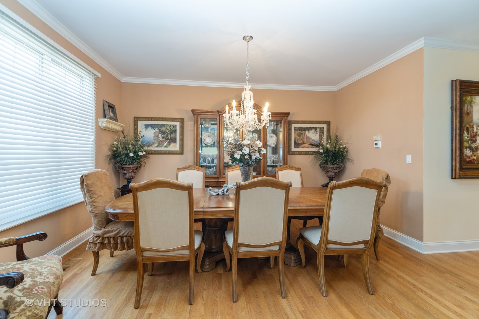 8 Torrin Rocks Cove Inverness, IL 60010 - Photo 9 of 30 a dining room with furniture a chandelier and wooden floor