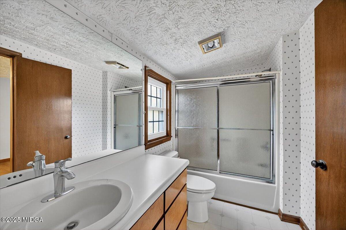 5682 Hartley Bridge Road Macon, GA 31216 - Photo 20 of 79 a bathroom with a sink toilet and shower