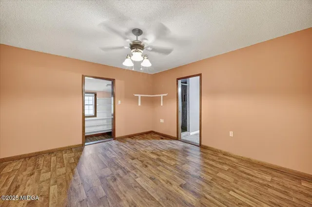 a view of a kitchen with a sink and dishwasher wooden floor