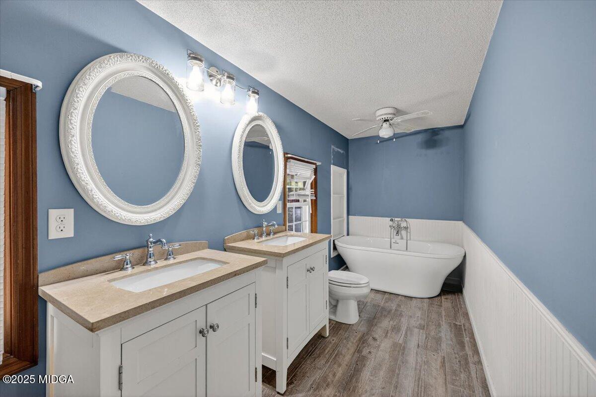 5682 Hartley Bridge Road Macon, GA 31216 - Photo 24 of 79 a bathroom with a sink and a mirror