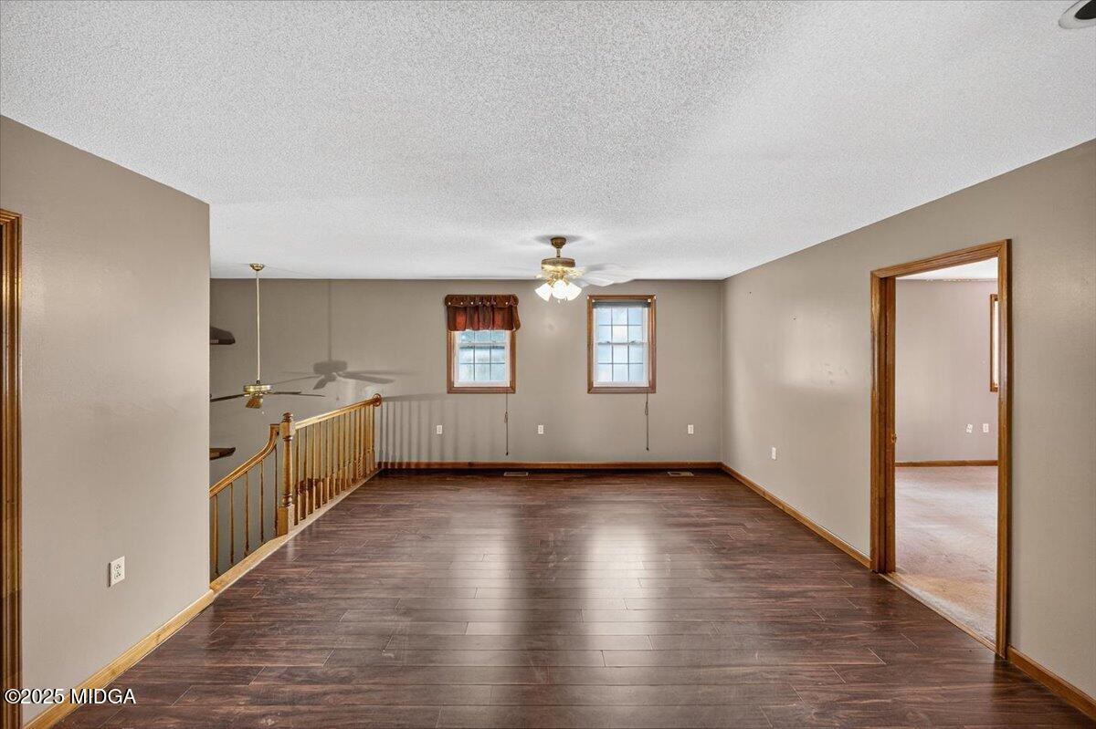 5682 Hartley Bridge Road Macon, GA 31216 - Photo 28 of 79 a view of a kitchen with a sink and dishwasher wooden floor