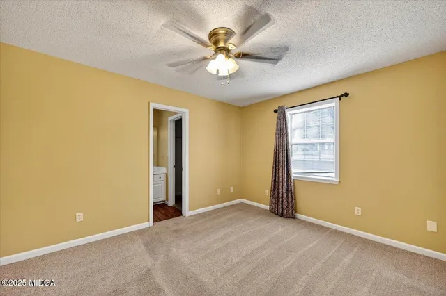 a view of a livingroom with a ceiling fan