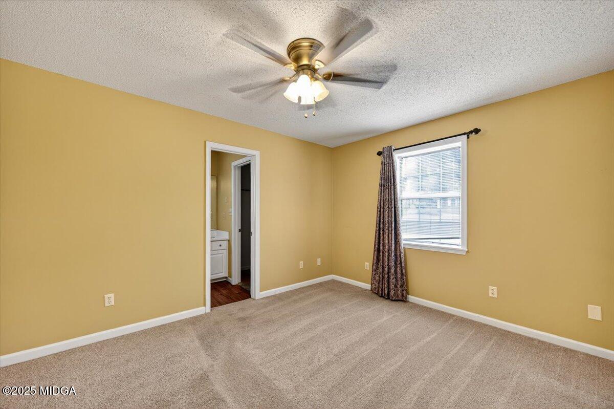 5682 Hartley Bridge Road Macon, GA 31216 - Photo 29 of 79 a view of an empty room with a window