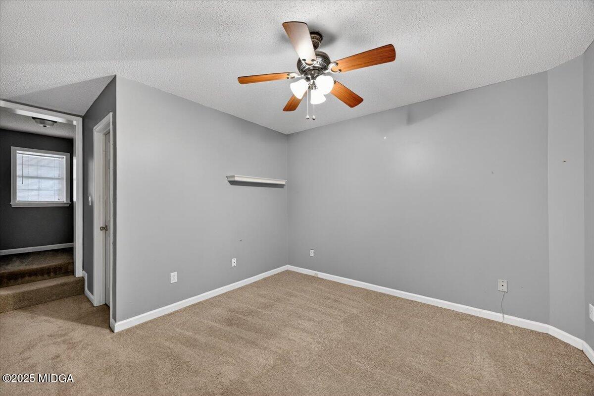 5682 Hartley Bridge Road Macon, GA 31216 - Photo 33 of 79 an empty room with closet and fan