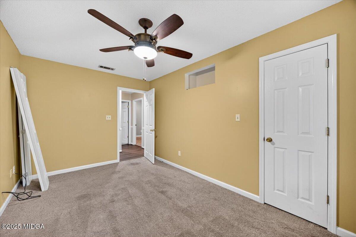 5682 Hartley Bridge Road Macon, GA 31216 - Photo 35 of 79 a view of a livingroom with a ceiling fan