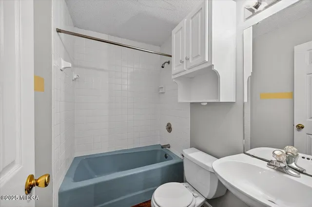 a bedroom with a bed and a cabinets