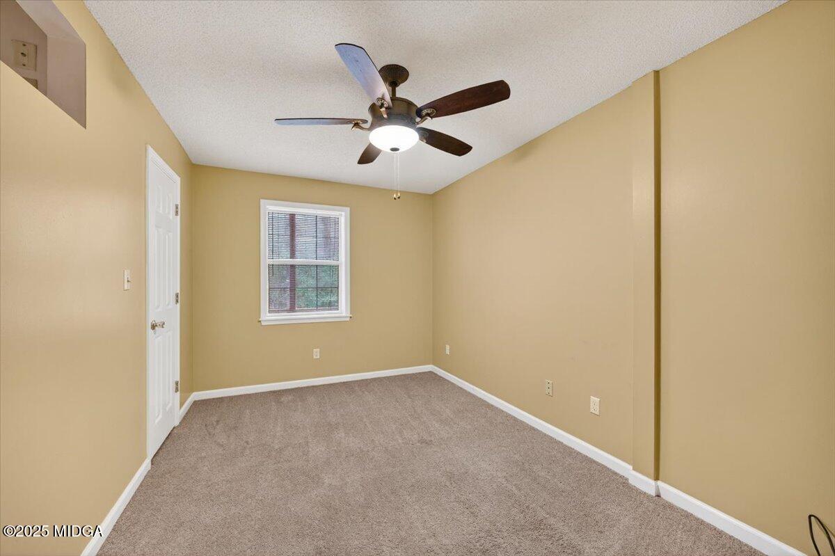5682 Hartley Bridge Road Macon, GA 31216 - Photo 40 of 79 a view of an empty room with a window