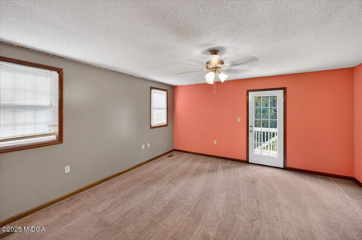 5682 Hartley Bridge Road Macon, GA 31216 - Photo 41 of 79 a view of an empty room with a window