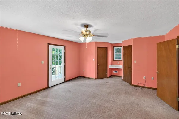 a view of balcony with wooden floor and fence