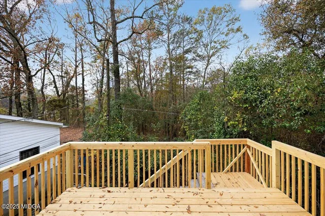 an aerial view of a house with a yard and trees
