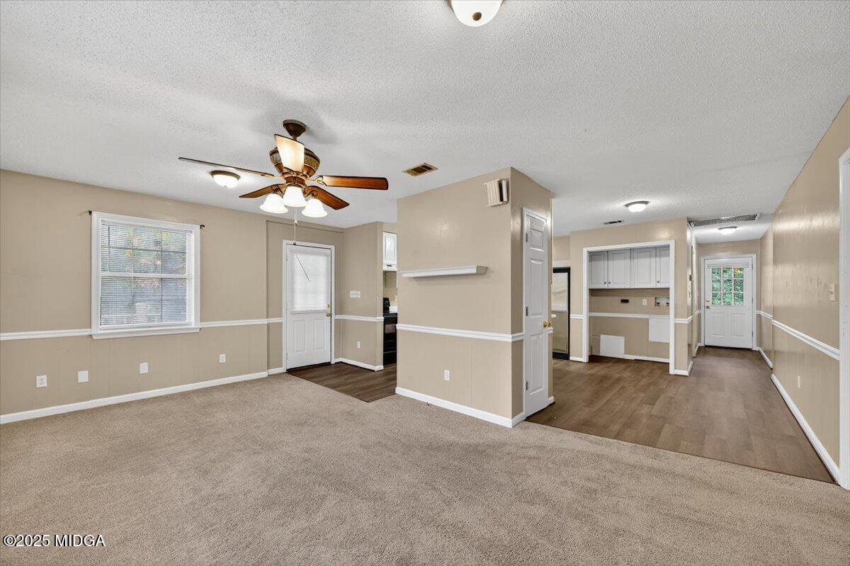 5682 Hartley Bridge Road Macon, GA 31216 - Photo 60 of 79 a view of a livingroom with a ceiling fan and window