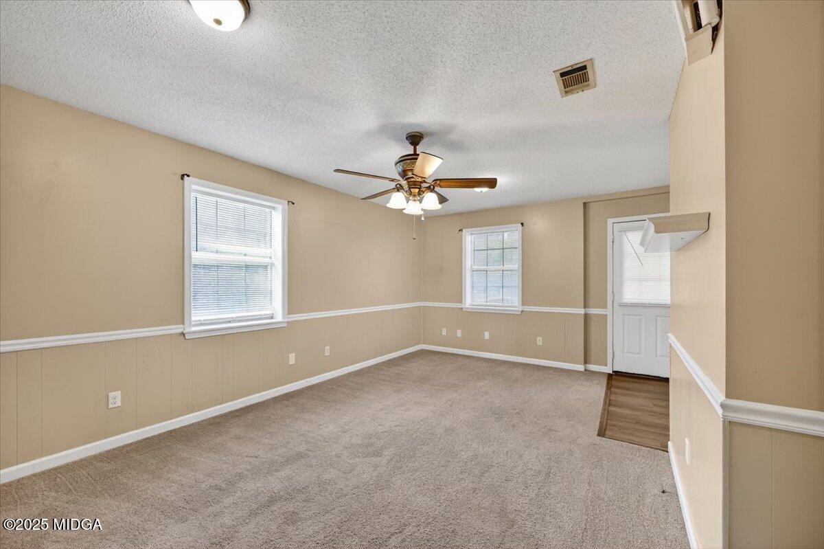 5682 Hartley Bridge Road Macon, GA 31216 - Photo 61 of 79 a view of empty room with wooden floor and fan