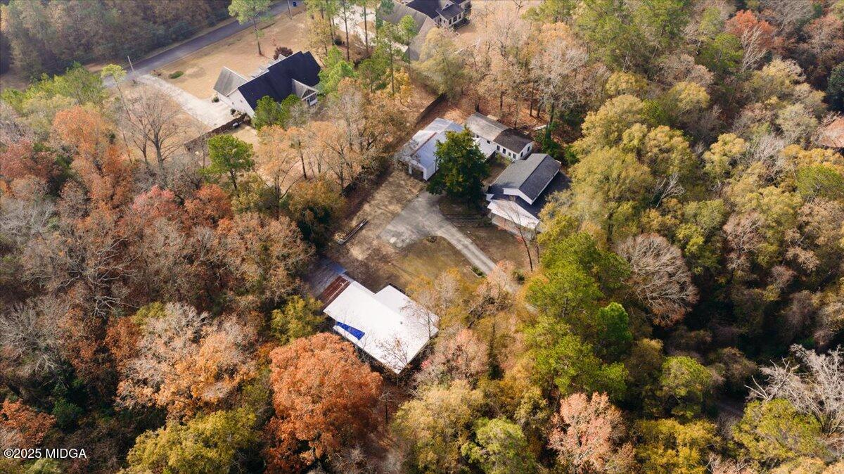5682 Hartley Bridge Road Macon, GA 31216 - Photo 78 of 79 an aerial view of a house with a yard and trees