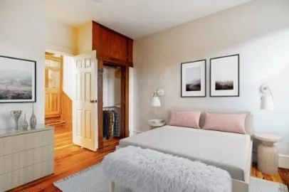 a bedroom with a bed and a couch