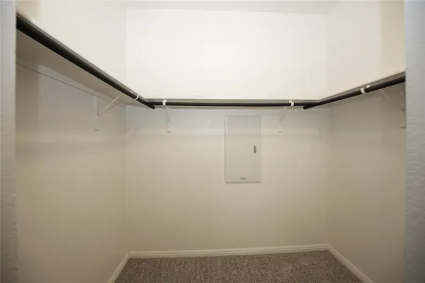 a view of a backyard with table and chairs and wooden fence