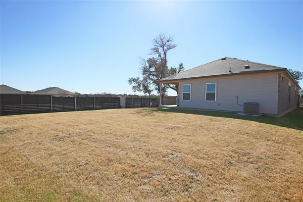 a view of a backyard of the house