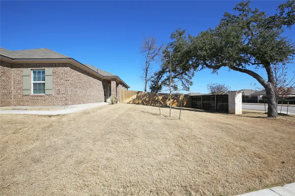 a view of backyard of a house