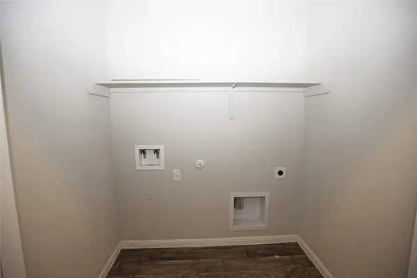 an empty room with a window and a ceiling fan