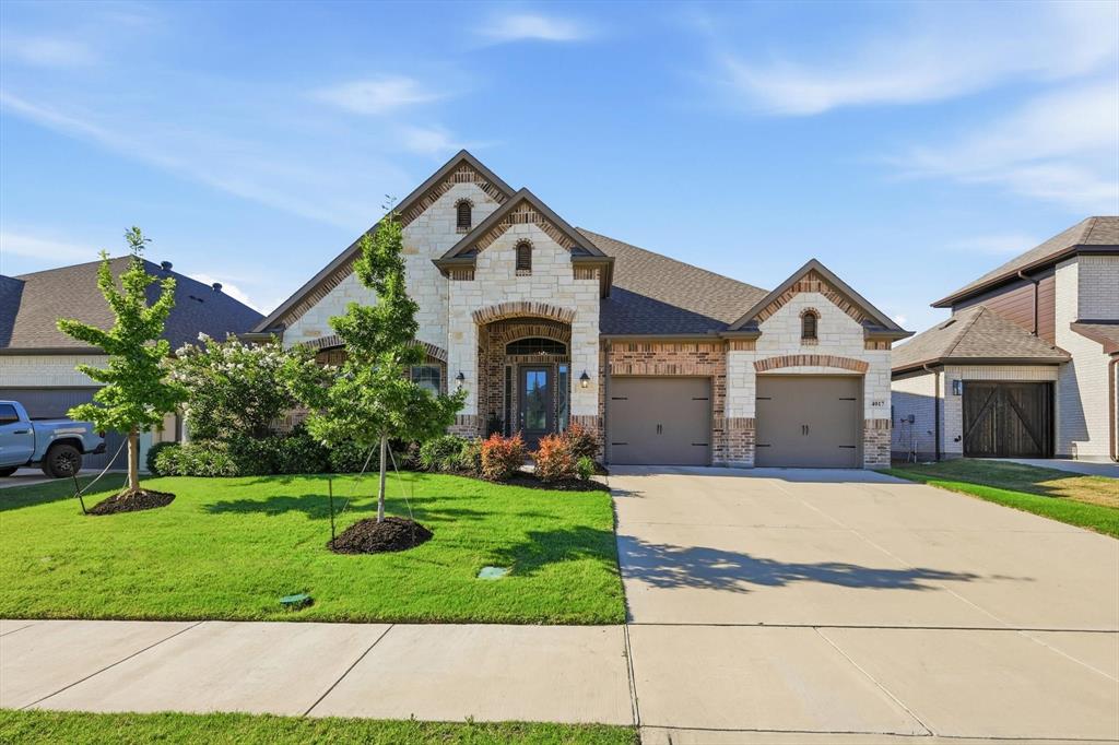 4017 Eagles Bluff Road Midlothian, TX 76065 - Photo 4 of 38 Stone and brick exterior with a prominent arched entry