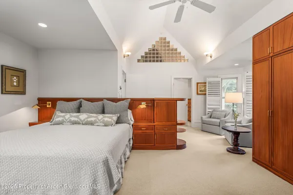 a bedroom with a bed and furniture