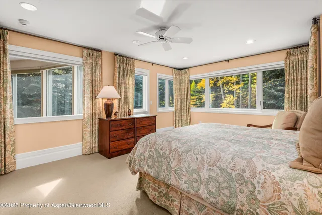 a bathroom with a double vanity sink toilet and shower