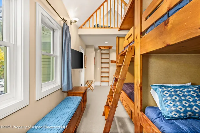 a blue and white car sitting in front of a building