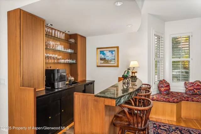 a kitchen with stainless steel appliances kitchen island granite countertop a stove a sink and a microwave