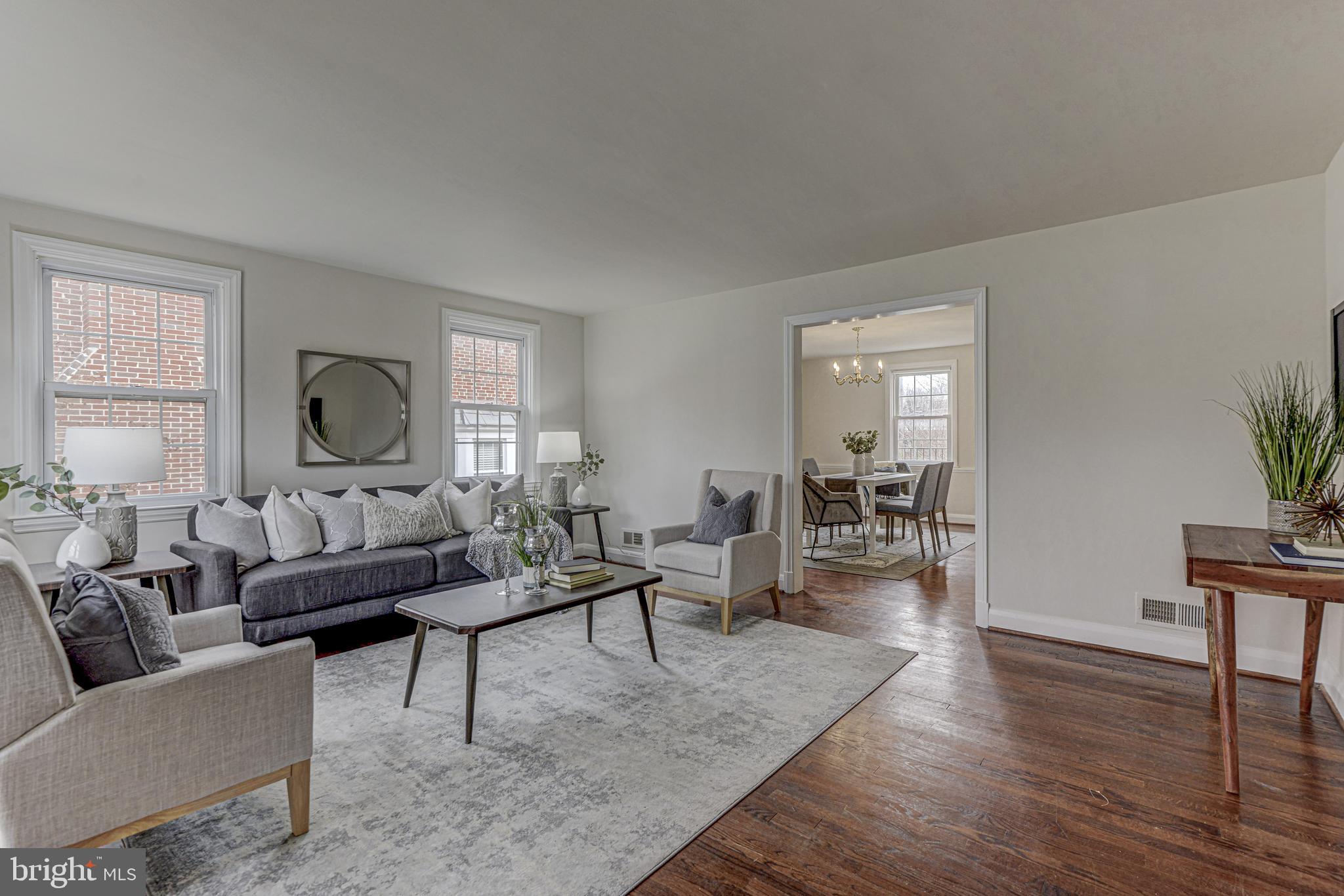 6121 Regent Park Road Baltimore, MD 21228 - Photo 2 of 36 a living room with furniture and wooden floor