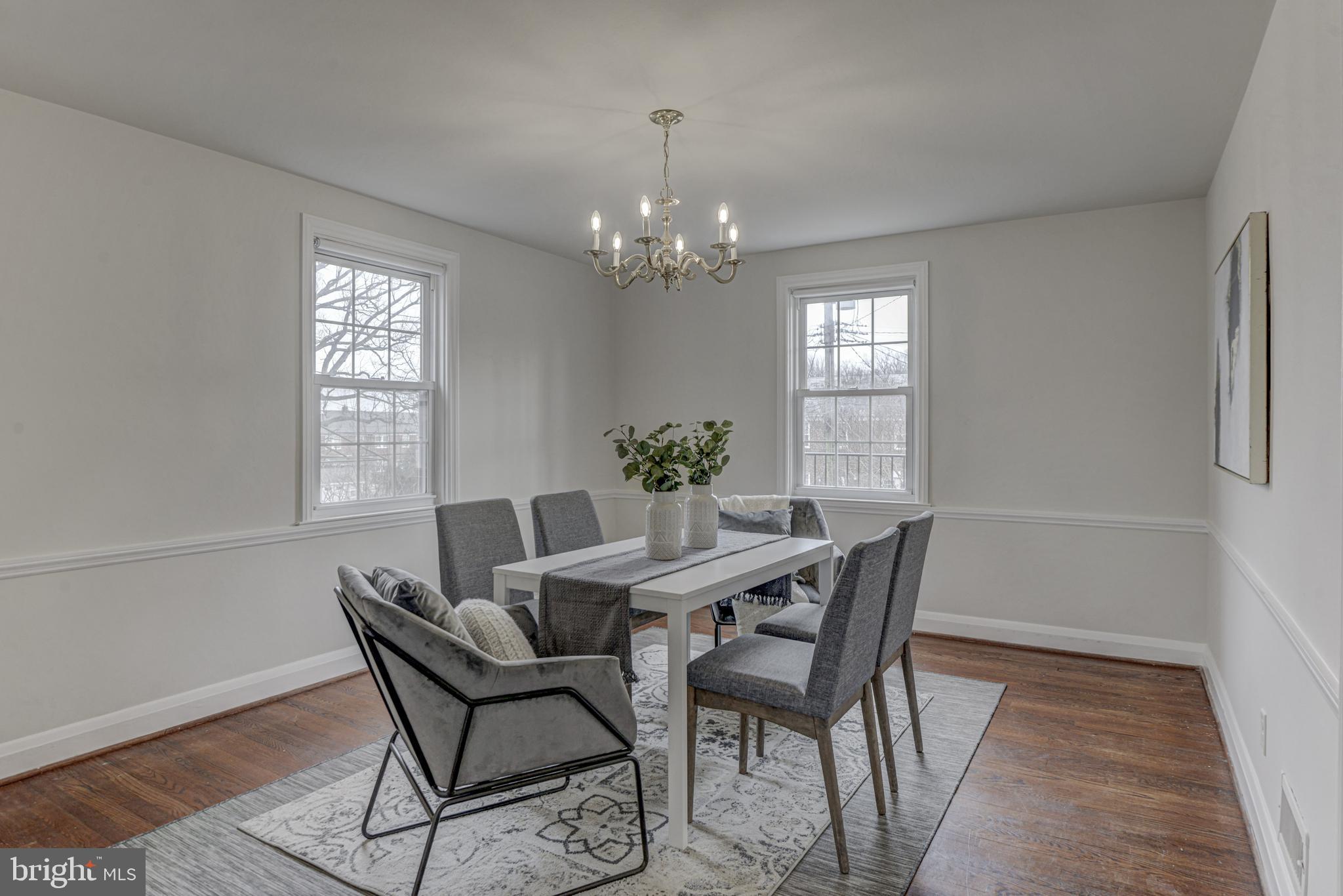 6121 Regent Park Road Baltimore, MD 21228 - Photo 11 of 36 a view of a dining room with furniture window and wooden floor
