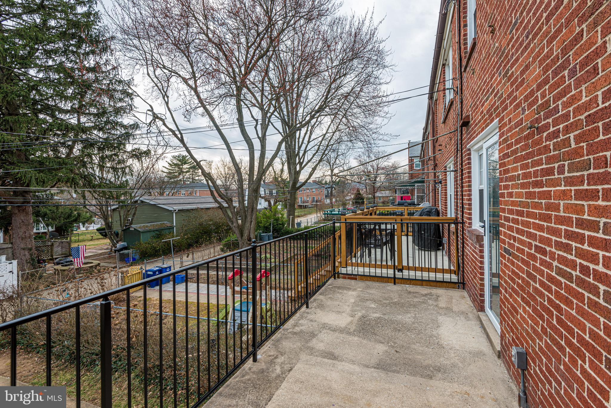 6121 Regent Park Road Baltimore, MD 21228 - Photo 20 of 36 a view of a house with backyard and trees