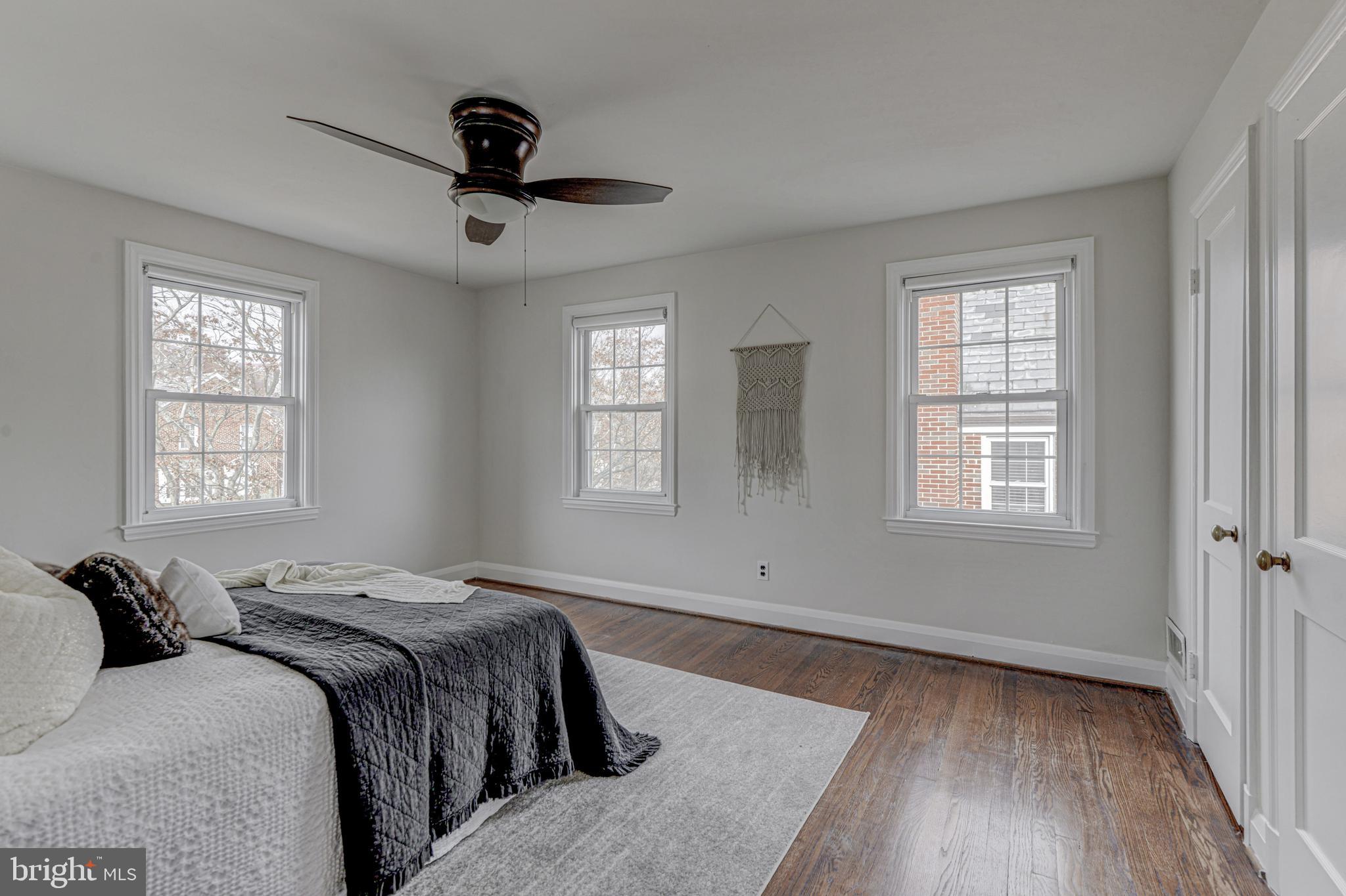 6121 Regent Park Road Baltimore, MD 21228 - Photo 21 of 36 a bedroom with a bed and a window