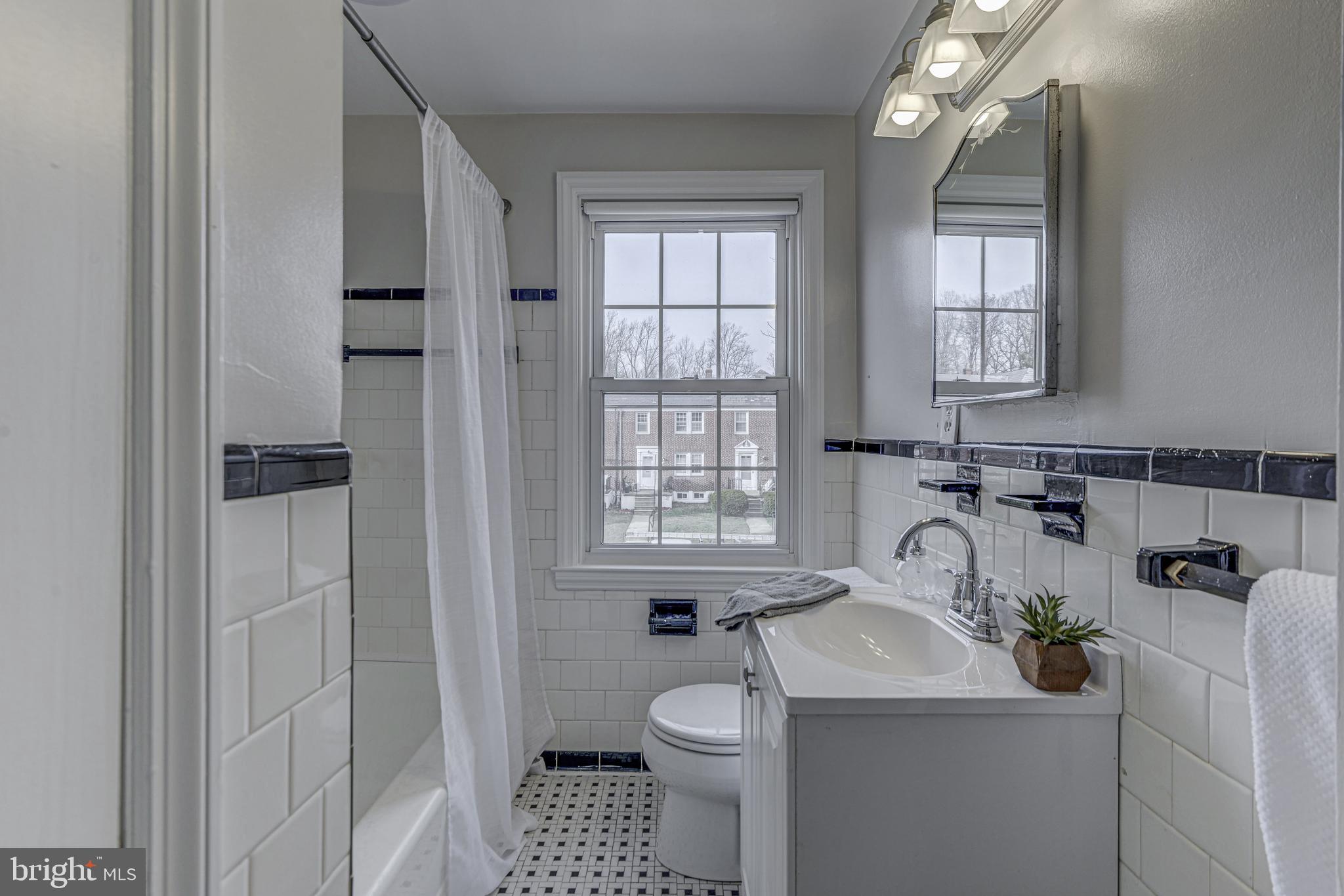 6121 Regent Park Road Baltimore, MD 21228 - Photo 25 of 36 a bathroom with a sink toilet and shower