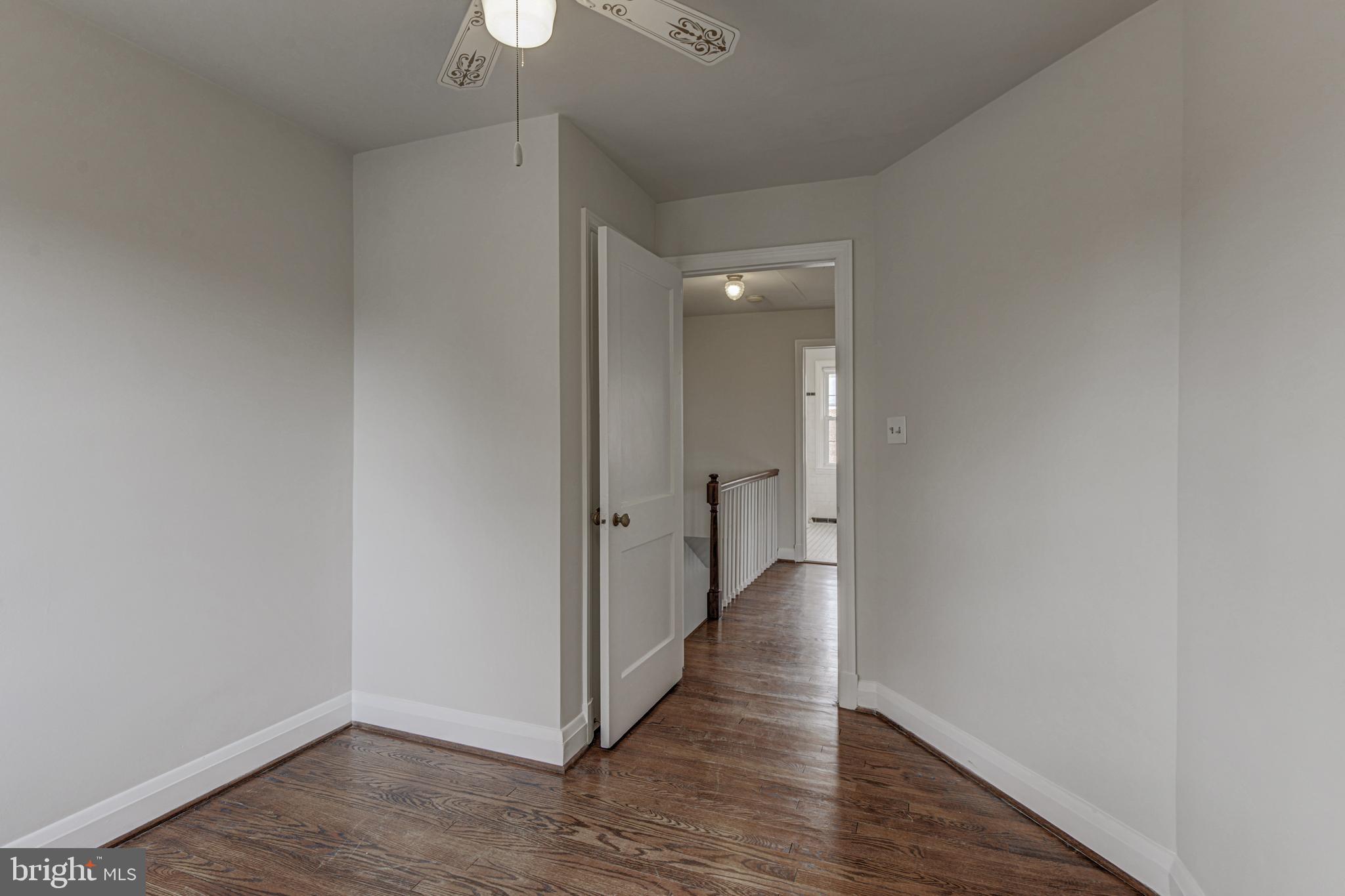 6121 Regent Park Road Baltimore, MD 21228 - Photo 29 of 36 a view of a hallway with wooden floor