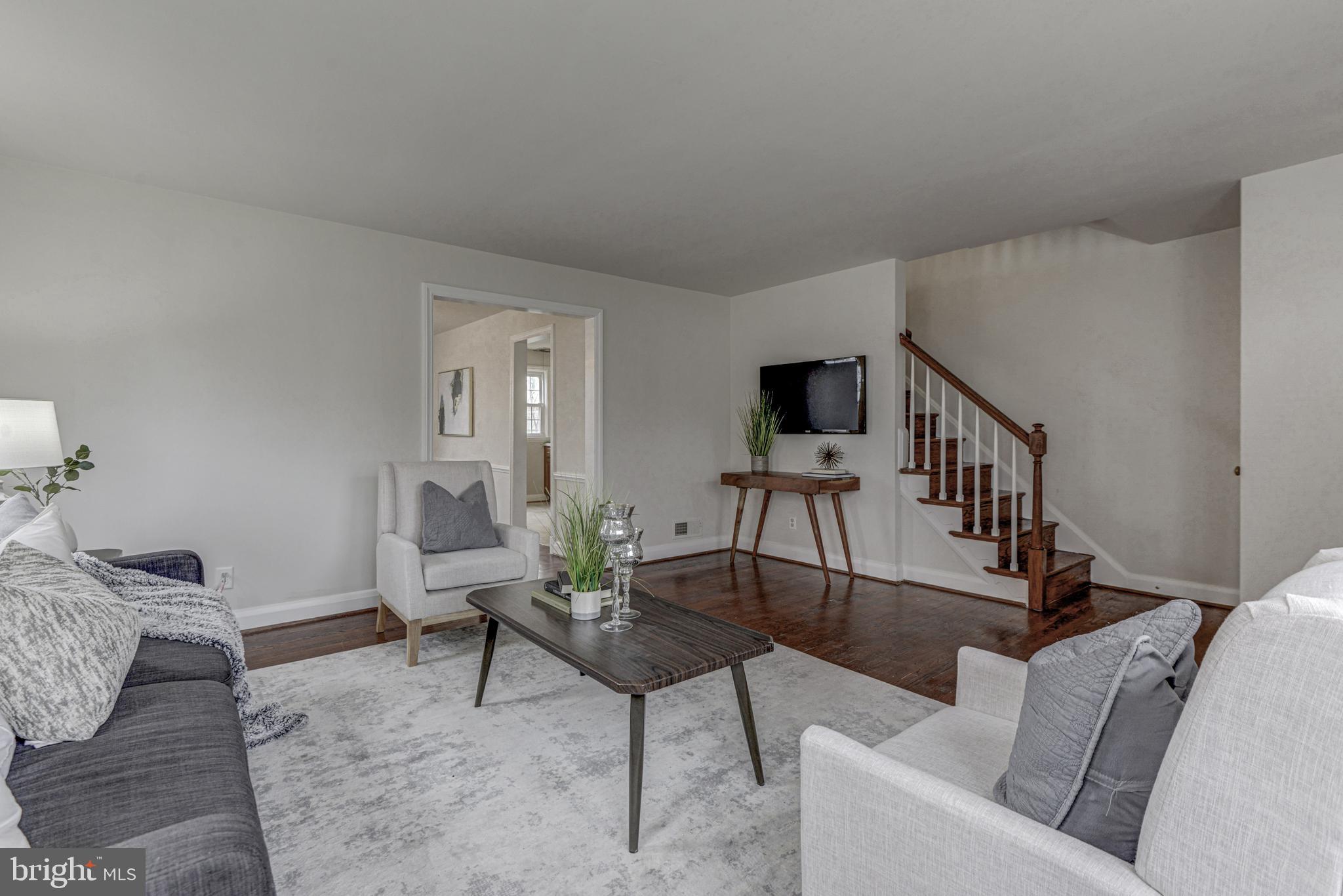 6121 Regent Park Road Baltimore, MD 21228 - Photo 5 of 36 a living room with furniture and a wooden floor