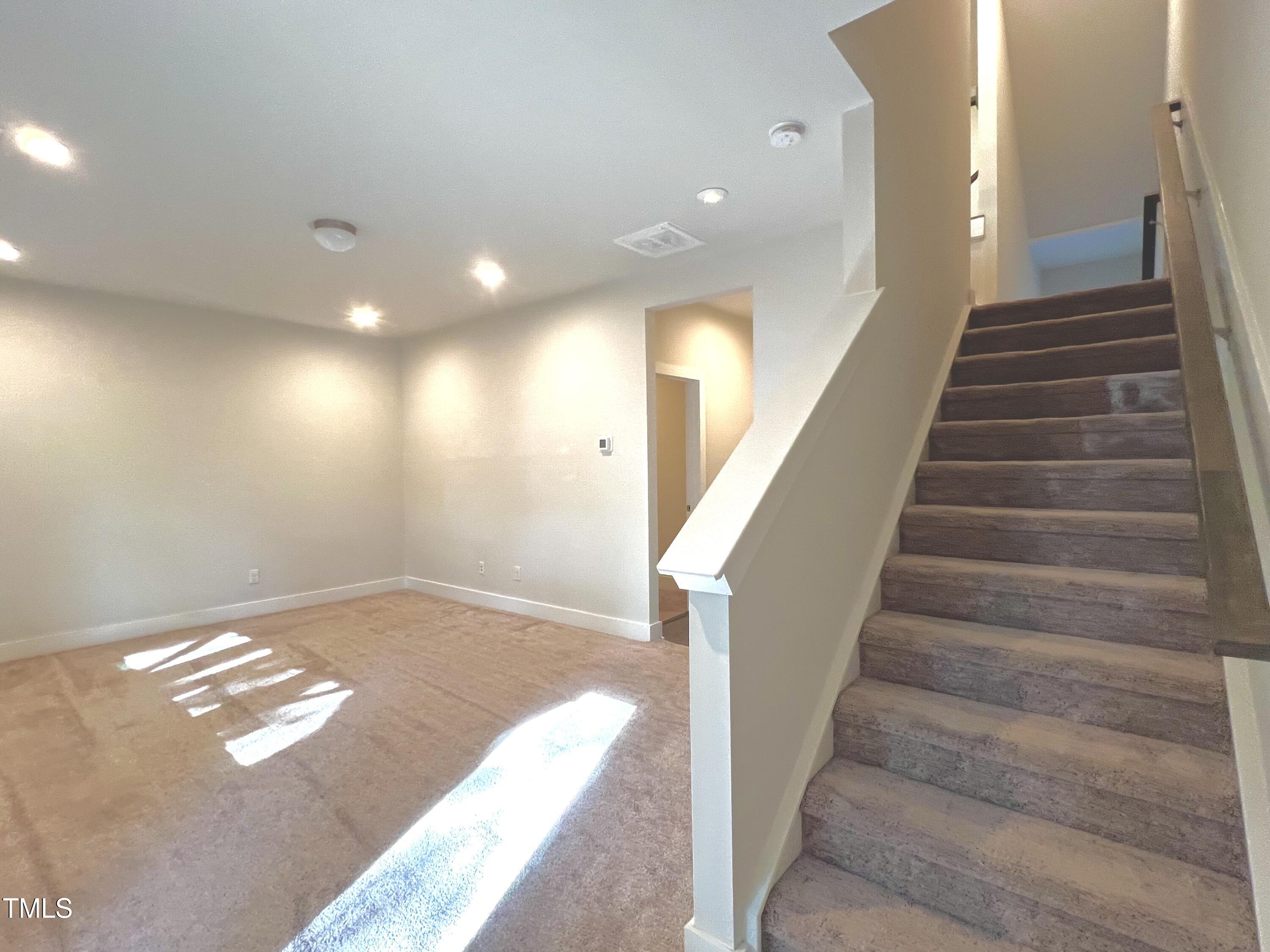 906 Waterside View Drive Raleigh, NC 27606 - Photo 18 of 27 a view of entryway and hall with wooden floor