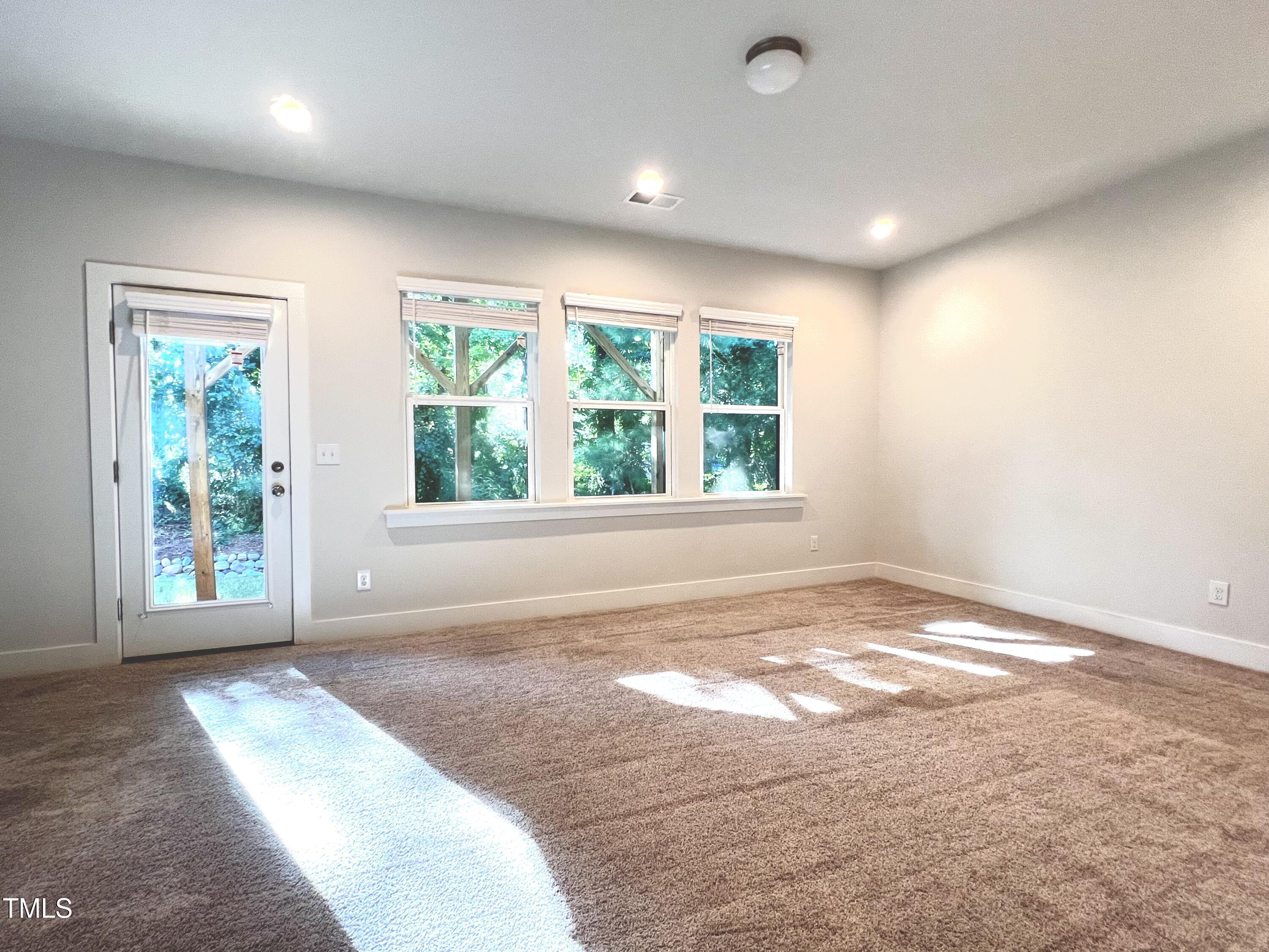 906 Waterside View Drive Raleigh, NC 27606 - Photo 19 of 27 a view of an empty room with a window