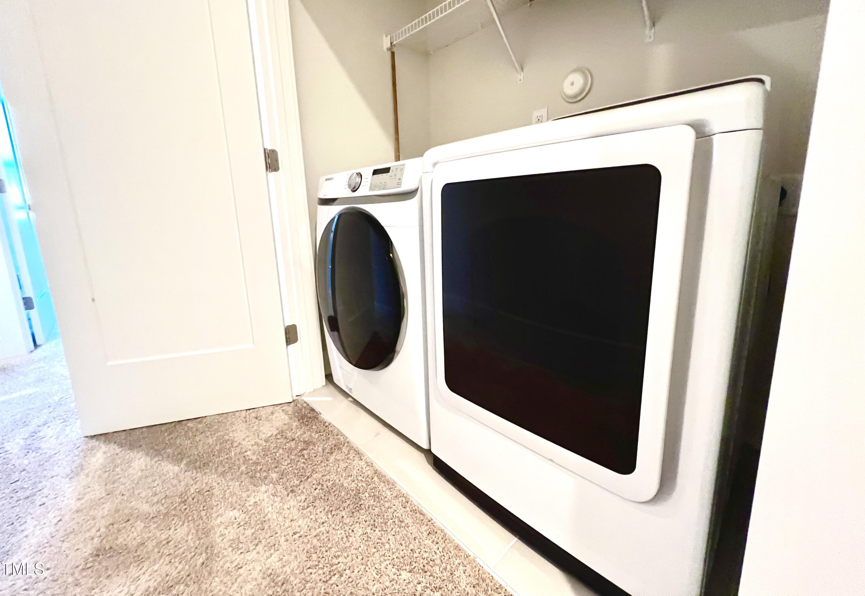 906 Waterside View Drive Raleigh, NC 27606 - Photo 26 of 27 a utility room with dryer and washer
