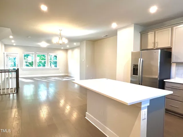 a view of a kitchen and dining room
