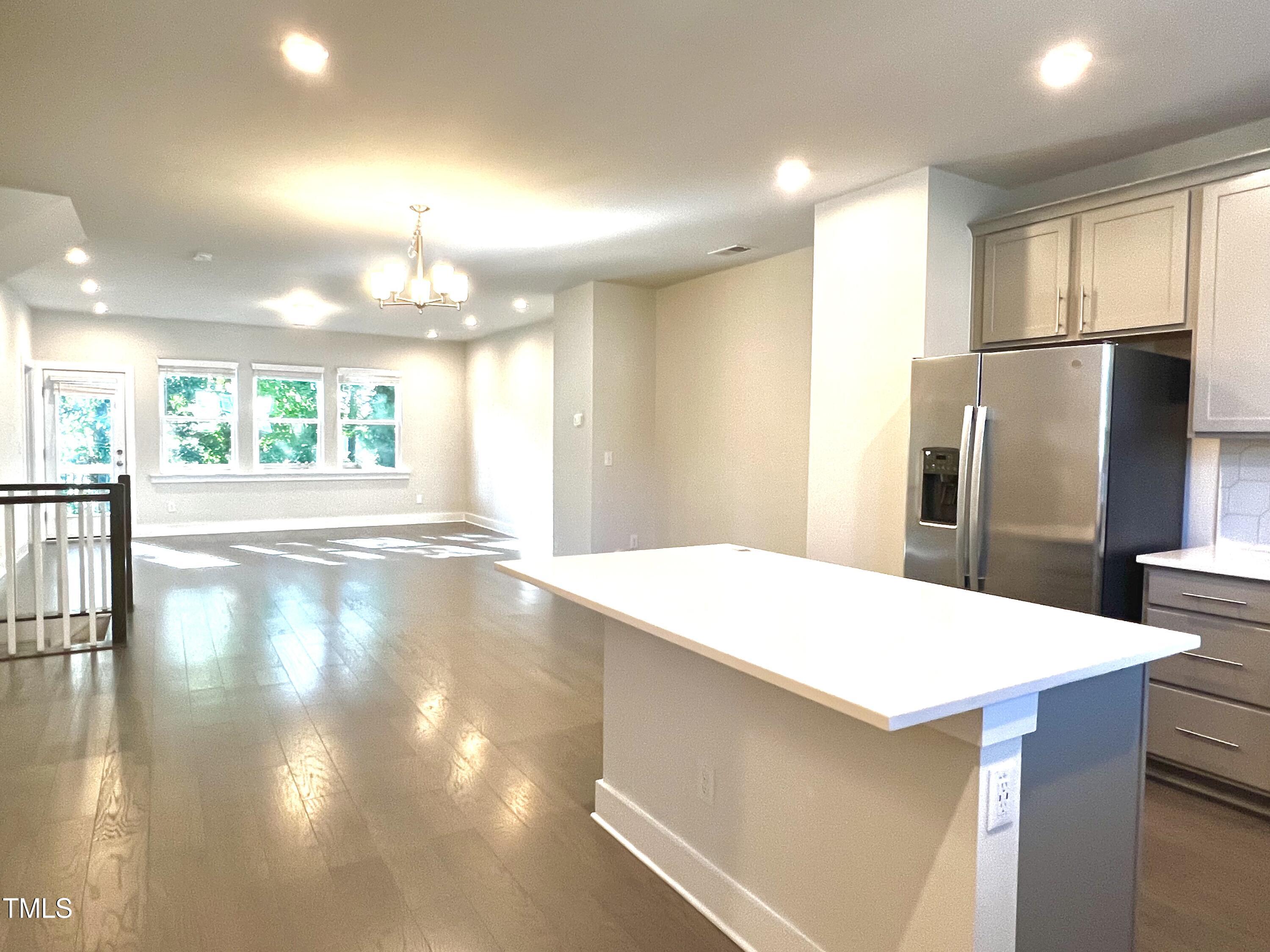 906 Waterside View Drive Raleigh, NC 27606 - Photo 3 of 27 a kitchen with stainless steel appliances a refrigerator and a stove